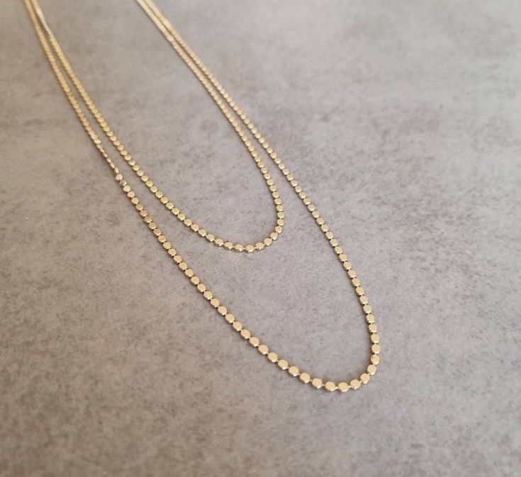 Simple and elegant gold plated duble necklace. Necklace length 1:  28 inch /  70 cm Necklace length 2: 23 inch / 60 cm Item will be shipped in a branded gift box. To continue shopping, check out my Etsy store: https://www.etsy.com/shop/HilaAssaJewelry **Standard Shipping Time** USA 6-12 days Canada 10-12 days Europe 8-10 days Upgrades are available at checkout Gold Double Strand Long Necklace As Gift, Gold Double Strand Necklace With Adjustable Chain, Gold Long Layered Necklace With Double Chain, Gold Double Chain Long Necklace, Double Strand Necklaces With Double Chain For Jewelry Making, Gold Layered Long Necklace With Double Chain, Gold Plated Multi-strand Necklace Gift, Gold Double Strand Necklace With Double Chain, Adjustable Gold Brass Long Necklace