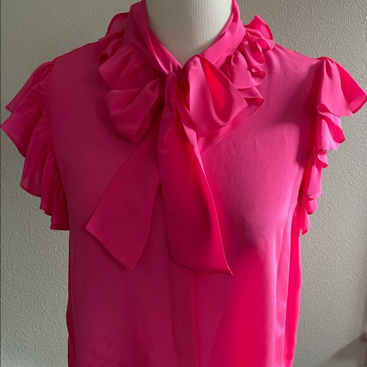 Gorgeous (Nwt) Alice + Olivia Fuchsia Short Sleeve, Bow, Ruffled Sleeve Blouse! Lightweight, Button Down, Made Of 100% Silk. Size Xl Bust (Laying Flat/Pit To Pit)-19 Inches Length (Laying Flat)-25 Inches Retails For $285 Price Firm, Just Reduced Thank You For Looking! No Trades. Ships Next Business Day Elegant Pink Tie Neck Top, Chic Pink Short Sleeve Blouse, Pink Short Sleeve Blouse For Party, Pink Ruffled Tops For Work, Pink Fitted Tie Neck Top, Pink Feminine Tie Neck Top, Pink Tie Neck Top For Work, Feminine Pink Tie Neck Top, Pink Tie Neck Top For Party