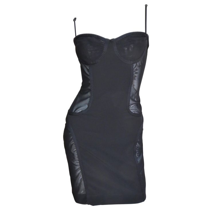 An incredible black dress from Moschino. It is lingerie inspired with an adjustable straps boned bra style top plus front and back panels of stretch bandage fabric. There are semi sheer side panels at the waist and thighs and it has a center back zipper. Fits sizes Small, Medium. Marked US size 8. Bust 34" Waist 28" Hips 37.50" Length 33" Boned Bra, Guilded Glamour, Moschino Dress, Girls Couture, Bra Style, Fashion Inspiration Design, Red Bottoms, Goth Outfits, Gianni Versace