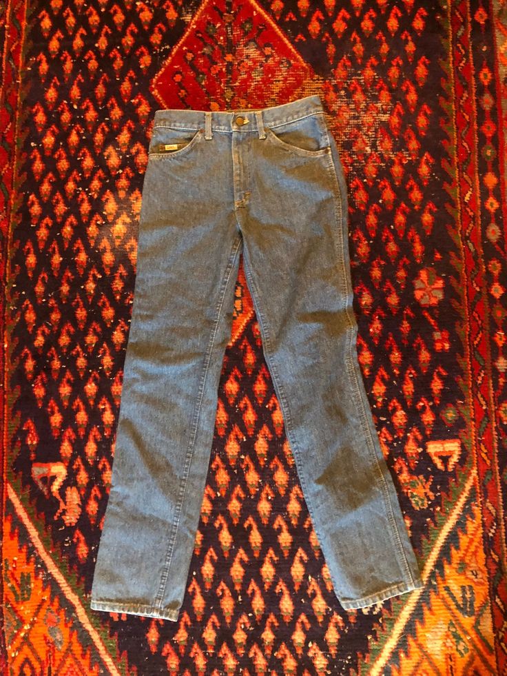 Vintage Lee Rider Jeans size US 4 - High quality denim - High waist  - Medium wash - Relax fit - Made in USA - In good vintage condition showing minor wear and age -  Fits like a US 4 - - 26 waist - Measurements are taken flat: ( compare with a pair of your fave jeans  ) Waist- 14" Hips -  17" Inseam- 30" Length-40" Vintage Fitted Cotton Jeans, Vintage High Rise Washed Pants, Vintage High-rise Washed Pants, Vintage Fitted Denim Jeans, Vintage Medium Wash Mid-rise Jeans, Vintage Light Wash Fitted Bottoms, Vintage Fitted Light Wash Bottoms, Vintage Mid-rise Medium Wash Jeans, Vintage Mid-rise Cotton Jeans