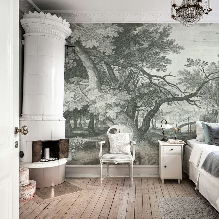 a bedroom with a large mural on the wall