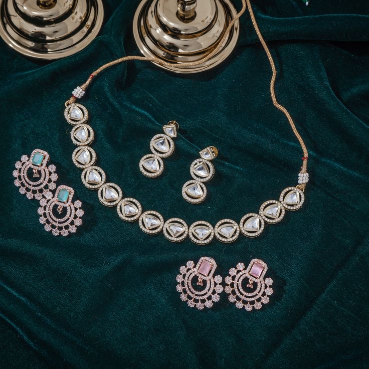 Step-in to the aura of timeless elegance with this must-have piece adding a touch of class to any ensemble! Embellish your look with subtle sophistication and enhance your style with this exquisite set crafted with luxurious and dazzling polki jadau kundan stones. The set includes a necklace and a pair of push-back earrings. Approximate earrings length is 1.5". Gold-plated on high-quality brass as base metal. In-stock & ready-to-ship. *Please Note: We use faux stones and beads in all of our jewe Elegant Festive Jewelry Sets With Gota Work, Gold Kundan Necklace With Zari Work For Designer Wear, Elegant Kundan Necklace With Meenakari And American Diamond, Elegant Kundan Bridal Sets With Zari Work, Bollywood Style Designer Jewelry With Gota Work, Designer Zari Work Chandbali Jewelry, Gold Kundan Necklace With Zari Work In Anarkali Style, Elegant Kundan Jewelry Sets With Gota Work, Elegant Chandbali Jewelry Sets With Zari Work