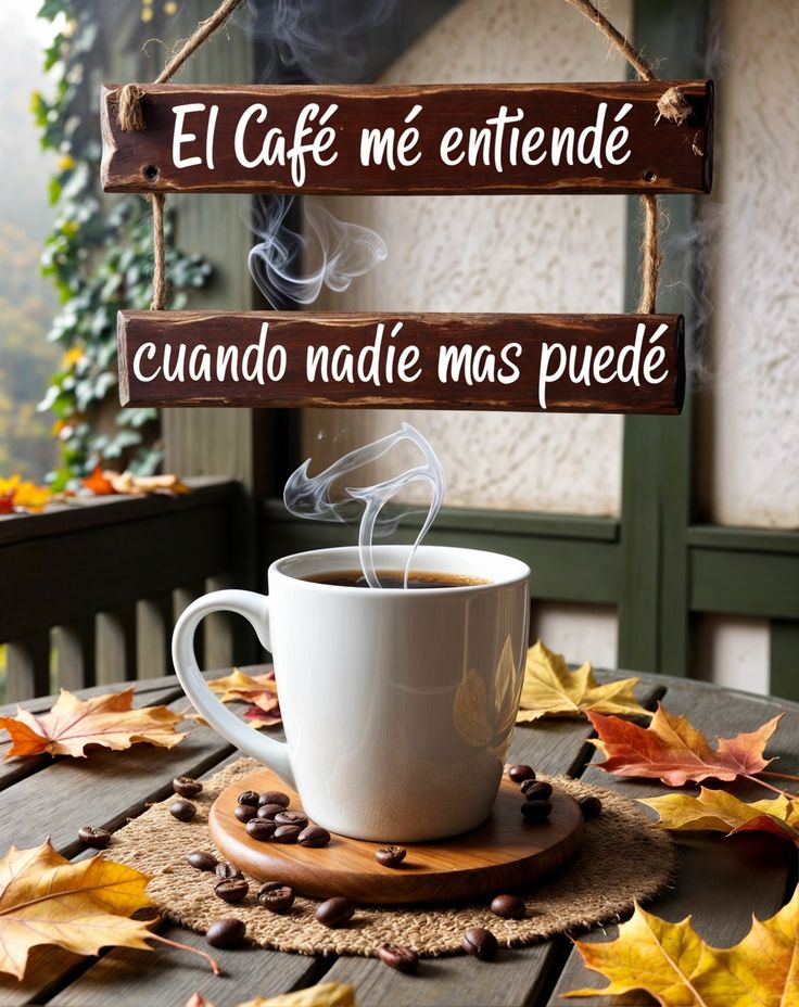 a cup of coffee sitting on top of a table next to a sign that says el cafe me entende cuado nadde mas peedes