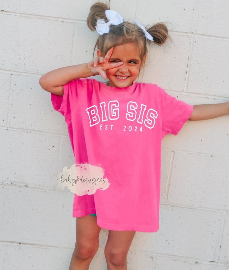 "Big Sister Shirt, Big Sis Est 2024 Shirt, Baby Announcement,  Youth Comfort Colors® Best Friends, Promoted to Big Sister, Funny Sister Shirt Keep your little ones on trend  when heading back to school with our concert inspired retro era design. Comfort Colors® are 100% heavyweight cotton.  They are soft and comfortable.  Sure to be a favorite. 📋 HOW TO ORDER: 1. Select the size (Comfort Colors is true to size - please size up 1-2  for oversized look) 2. Select the color (Limited colors availab Big Sis Shirt, Older Sister T Shirt, Big Brother Big Sister Shirts, Pink Cotton College Shirt, Pink Crew Neck Shirt For College, Pink Short Sleeve Tops With Team Name, Pink School Spirit T-shirt With Name Print, Pink School Spirit Tops With Name Print, Pink Crew Neck Top For School Spirit