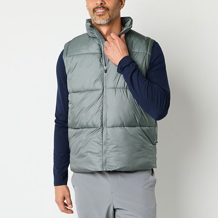 Xersion's men's puffer vest is a super smart style offering warmth for cooler temps. Made from a woven fabric, it has a mock neck, side pockets and a front zip closure.Closure Type: ZipperFit: Regular FitNeckline: Mock NeckPockets: 2 Front Zip PocketsSleeve Length: SleevelessApparel Length: 27 InchesFiber Content: 100% NylonFabric Description: WovenFilling Content: 100% PolyesterLining Material: PolyesterCollar: Zip CollarCare: Tumble Dry, Machine WashMaterial: NylonCountry of Origin: Imported Sportswear Tops With Pockets For Sports, Casual Sports Tops With Pockets, Sports Tops With Pockets For Fall, Fall Sports Top With Pockets, Solid Sportswear Tops With Pockets, Urban Tops With Pockets For Outdoor Activities, Gray Casual Vest With Pockets, Casual Gray Vest With Pockets, Winter Nylon Tops With Pockets