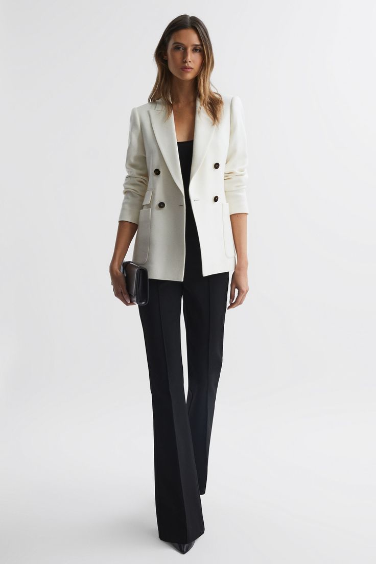 Find REISS Larsson Double Breasted Twill Blazer on Editorialist. The Larsson blazer in white offers tailored simplicity with a soft finish. The double-breasted silhouette features wide peak lapels and button fastenings with front pockets for added functionality. Layover casual tops for a high-impact look, or pair with heels for a formal aesthetic. Wool-blend fabrication Pronounced twill weave Peak lapels Double-breasted silhouette Four-button design Buttoned cuffs Single vent to reverse Fully lined The model is wearing a size 8 Measurements of model: Height 5ft 10 / 178cm Ivory Blazer Outfit, Structured Pants, Outfit Formal Mujer, Formal Aesthetic, White Blazer Outfits, Modern Blazer, Women Blazers, Amal Clooney, Blazer Outfit