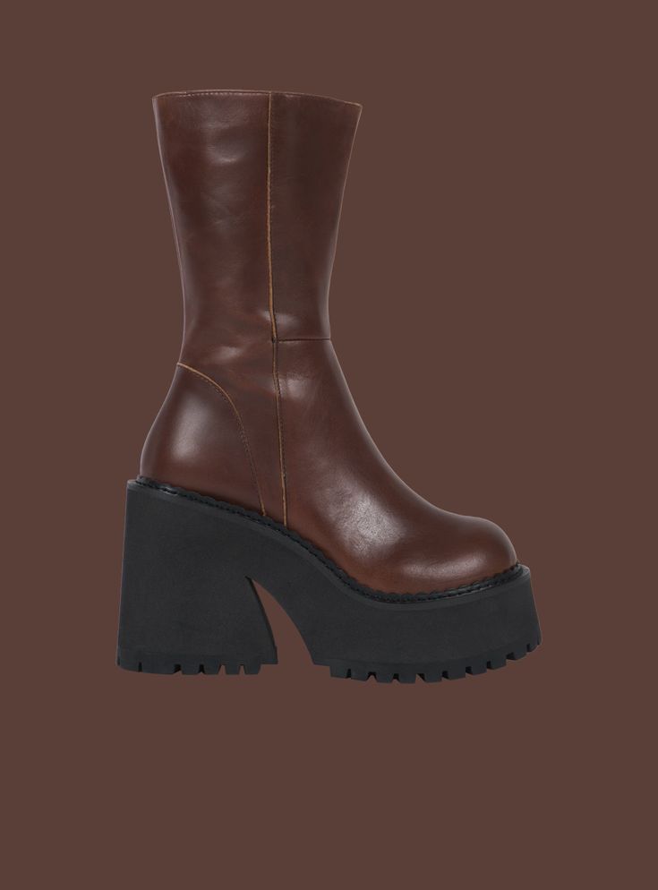 The Parker Boot has a soft leather upper with side zip and a chunky platform sole that measures 1.75" in front and 4.25" at the heel. Lined inside with leather as well. SHOES ARE LISTED IN U.S. WOMEN'S SIZES. Click Here for a printable size chart (make sure you print at Actual Size to ensure accuracy) For any questions about sizing please reach out to our team ~ help@unifclothing.com Imported SKU: UWBO-1058 Unif Parker Boots, Unique Shoes, Secret Sale, Black Women Fashion, Chunky Platform, Pretty Shoes, Shoe Style, Fashion Sewing, Brown Boots