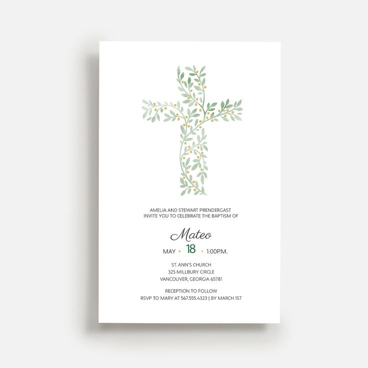 a white card with green leaves and a cross in the middle, on top of it