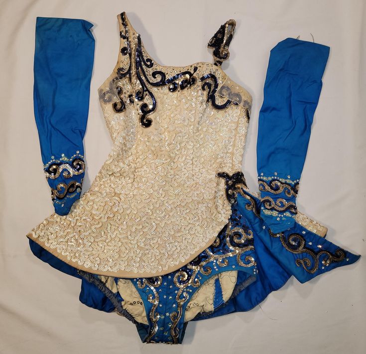 This is another incredible 1950s costume made by John Baur for the Frosty Follies Ice Show Includes mini dress, bloomers and gauntlet gloves Overall nice vintage condition   Shows some signs of wear but to be expected due to age and use Theee are some missing or damaged sequins and jewels Some fading and discoloration seen I believe the gloves might be two right sleeves One has a stuck wrist zipper The costume zipper works well Really well made quality old costume and is built to last Very wearable  Wonderful details See photos for details  Questions welcome  Please note that all sales are final  Measures approximately  Top bust 30 inches Waist 24 inches  Bottoms waist 22-23 inches  Hips 32-37 inches  Rise crotch to waist 22 inches Vintage Fitted Party Costume, Fitted Blue Costume For Winter, Vintage Fitted Costumes For Costume Party, Vintage Fitted Costume For Costume Party, Fitted Vintage Costume For Costume Party, Fitted Sequin Costume Dress, Fitted Traditional Dance Dress, Traditional Fitted Costume For Costume Party, Traditional Fitted Costume Dress