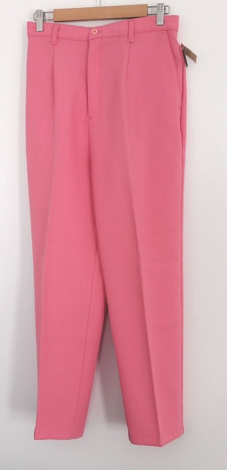 Elevate your wardrobe with these stylish Alicia dress pants in a beautiful pink shade. Designed with a classic straight leg and pleated front, these pants are perfect for any occasion, from casual to formal. The high-rise waist and elastic stretch provide comfort and a flattering fit. Featuring a zipper closure and made from breathable polyester knit fabric, these pants are both stylish and comfortable. The vintage look adds a touch of uniqueness to your outfit. These pants are a wardrobe must-h Solid Spring Dress Pants With Tapered Leg, Casual Pink Straight Leg Dress Pants, Pink Stretch High-waisted Dress Pants, Pink Stretchable High-waisted Dress Pants, Tailored Pink Summer Bottoms, Pink Stretch Straight Leg Dress Pants, Pink Tapered Leg Bottoms For Spring, Casual Pink Dress Pants For Summer, Classic Pink Pants For Spring