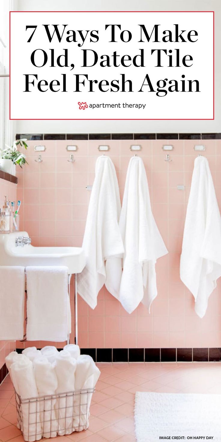 towels hanging on the wall in a bathroom with pink tiles and tile flooring that says 7 ways to make old, dated tile feel fresh again