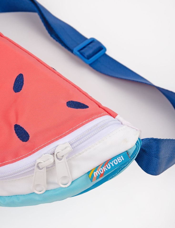 Be the epitome of summer and walk around with a bag that's the shape of a juicy slice of watermelon! This rad fanny pack also doubles as a cross-body bag! Features a double pull main zipper compartment and lining pocket. Constructed with with water resistant 100% nylon pack cloth. Color block rind detail & embroidered watermelon seeds. Explore all Fruit Slice Slings Adjustable 1.5" nylon seat belt webbing strap. Total bag + strap circumference minimum- 35"Total Bag + strap circumference maximum- Embroidered Watermelon, Watermelon Seeds, Fruit Slice, Webbing Strap, Seat Belt, Bag Straps, Fanny Pack, Body Bag, Cross Body