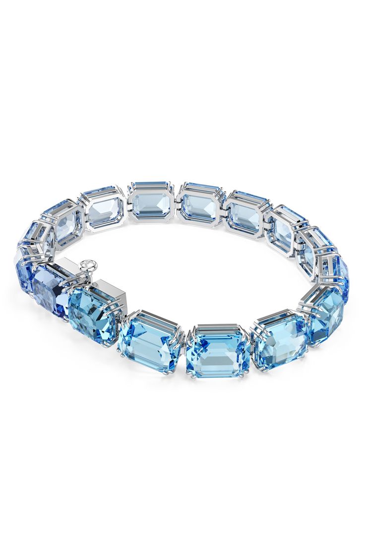 This modern tennis bracelet gives intense color to your stack with blue octagon-cut crystals. 6 3/4" length; 1/2" extender; 1/4" width Push-clasp closure Crystal/rhodium plate Imported Swarovski Millenia, Texture Jewelry, Textured Bracelet, Fringed Belt, Lipstick Bag, Chain Strap Bag, Oversized Tote Bag, Swarovski Bracelet, Floral Shoes