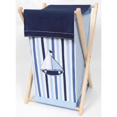 a blue and white striped laundry hamper with a sailboat on it's side