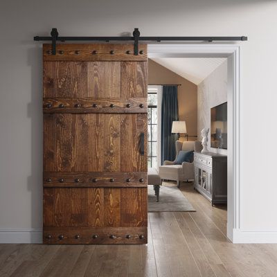 an open wooden door in a living room