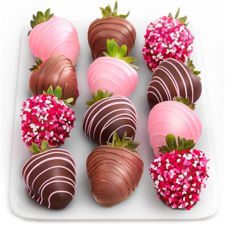 chocolate covered strawberries are arranged on a plate