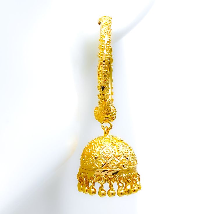 These 22k gold Bali earrings feature a festive, fine-beaded chandelier design, weighing 23.3 grams. Finished in yellow gold, they have a diameter of 1.1 inches and a total length of 2 inches. Ideal for those who seek a blend of traditional style and ornate detailing, these earrings add a glamorous and celebratory touch to any look, making them perfect for special occasions and festive events. Product Details Gold Purity(karat): 22k Gold Weight(grams): 23.3 Item Finish: Yellow Gold Earring Style: Bali/Hoop Earring Earring Diameter: 1.1" Earring Length: 2" 22k Gold Dangle Jhumkas For Festive Occasions, Festive 22k Gold Dangle Jhumkas, 22k Gold Traditional Chandelier Earrings For Festivals, Traditional 22k Gold Chandelier Earrings For Festivals, 22k Gold Dangle Jhumkas For Festivals, Festive 22k Gold Chandelier Earrings With Latkans, Festival 22k Gold Dangle Jhumkas, Yellow Gold Bridal Dangle Earrings For Festive Occasion, Festive Yellow Gold Bridal Dangle Earrings