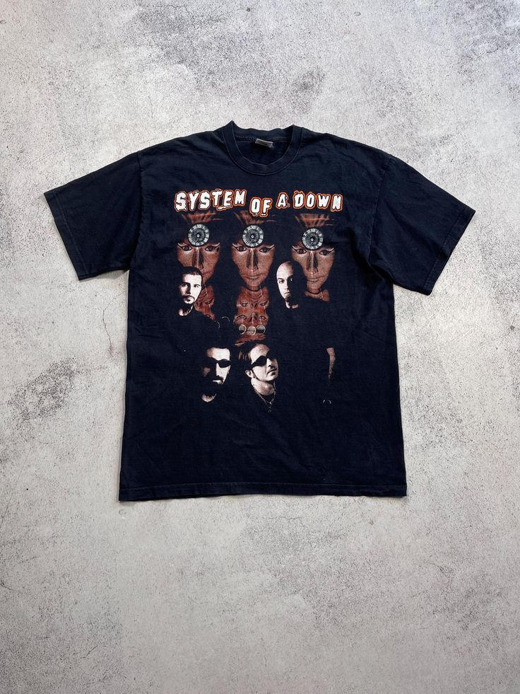 This vintage System of a Down T-shirt is a rare find for any fan of the band. The graphic print features the band's logo in bold black ink on a comfortable cotton material. With a crew neckline and short sleeves, this shirt is perfect for any season and occasion. The shirt is a size M and has a regular fit, making it a great addition to any wardrobe. Its 90s music theme is sure to turn heads and make a statement. Don't miss out on the chance to own this unique piece of band memorabilia. Size M (see measurements) From shoulder to shoulder - 50 cm From armpit to armpit - 51 cm The length of the back is 70 cm Condition 9/10🔥  See all photos and read description.   If you need any other information about postage, sizes, photos, etc., please contact me💌   I will be happy to help you🤝    Brow Vintage Graphic Print T-shirt For Alternative Fashion, Relaxed Fit Band Merch T-shirt With Logo, Band Merch Cotton T-shirt With Band Logo, Cotton Band Merch T-shirt With Logo, Band Logo Cotton T-shirt, Cotton Band Logo T-shirt Merch, Grunge Short Sleeve T-shirt For Concert, Cotton Band Merch T-shirt, Band Merch T-shirt With Logo For Concert