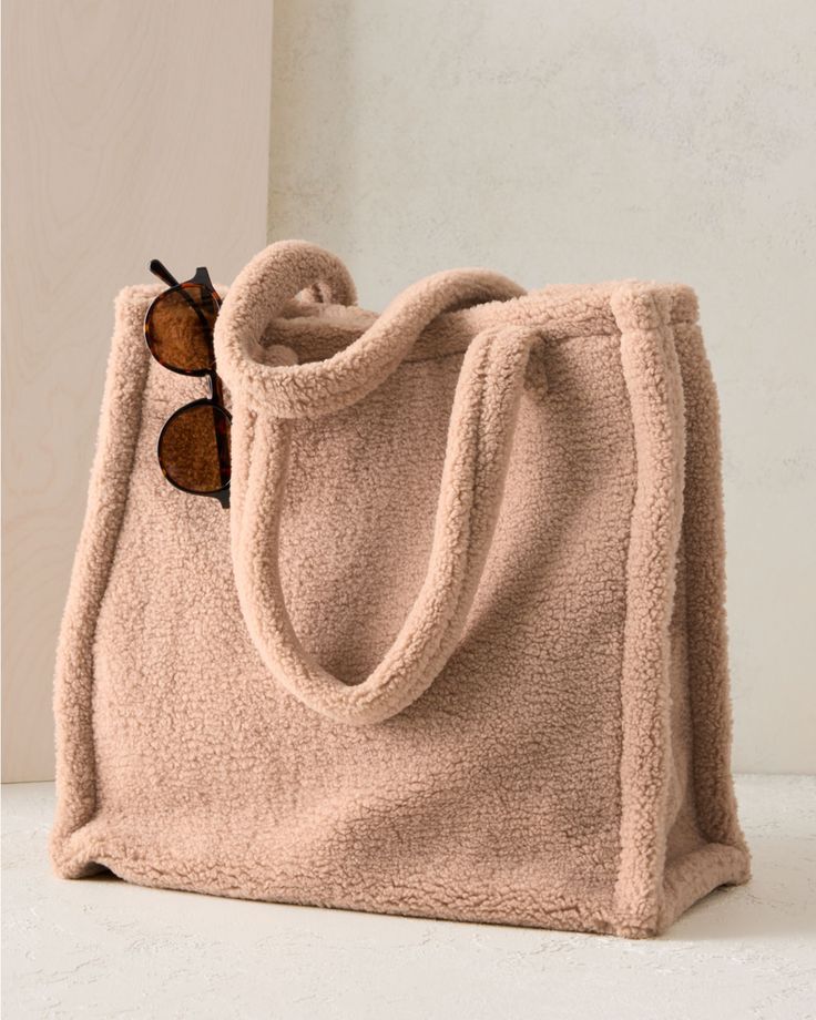 This so-soft teddy tote is so fun for the season. Sized to carry all your essentials — and then some — and styled to take you from workday lunch to weekend getaway. By Hat Attack. Open top with magnetic closure. Inside zip pocket. Trendy Bags For Daily Use With Soft Interior, Trendy Bags With Soft Interior For Daily Use, Trendy Bags With Soft Interior For Everyday Use, Soft Shoulder Bag For Daily Use, Winter Bags With Soft Interior For Daily Use, Casual Tote Bag With Soft Interior, Casual Soft Bags For Winter, Everyday Tote Shoulder Bag With Soft Interior, Everyday Bags With Double Handle And Soft Interior