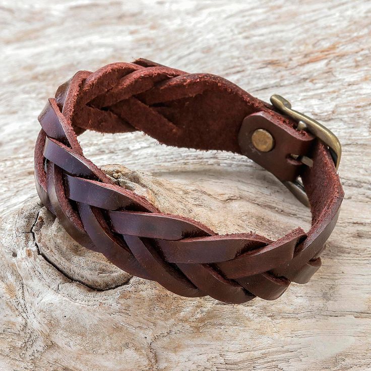 Perfect for all occasions this bracelet circles the wrist with hand-braided leather strips in a solid espresso hue. Chaloemphon presents this stylish bracelet from Thailand. It closes with an adjustable brass buckle. Adjustable Brown Leather Bracelet With Wrist Strap, Brown Leather Braided Bracelet, Brown Braided Leather Bracelets, Vintage Adjustable Brown Braided Bracelets, Adjustable Vintage Brown Braided Bracelets, Adjustable Brown Vintage Braided Bracelet, Adjustable Brown Braided Vintage Bracelet, Brown Leather Braided Jewelry, Brown Braided Leather Jewelry