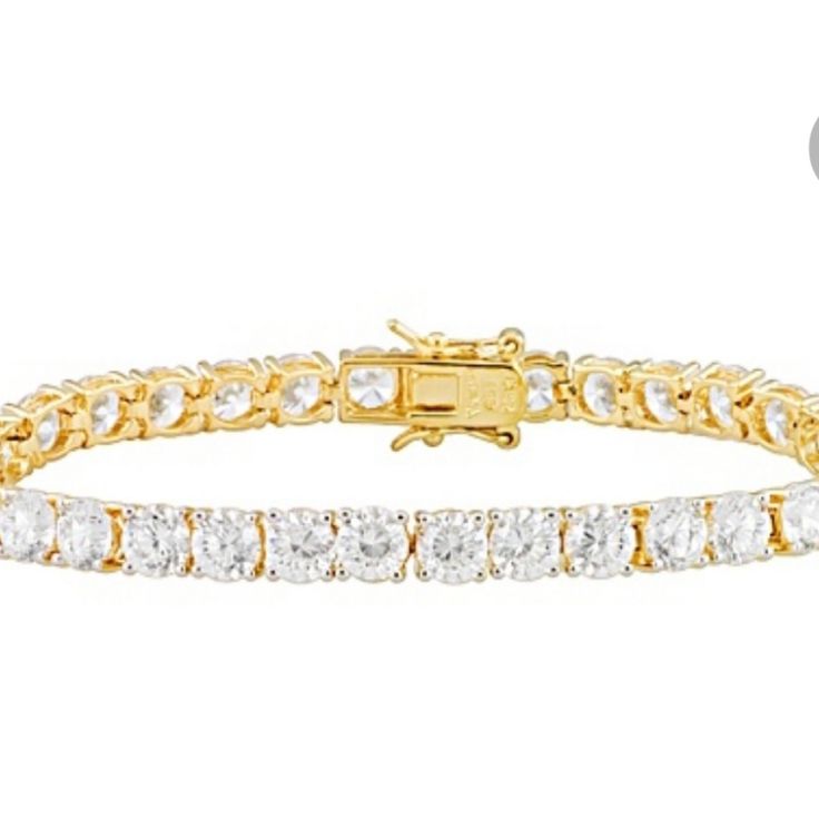 B94 $130.00 7.5" Tennis Bracelet. Bella Luce 25.92ctw Created Cz 18kt Gold Over .925 Sterling Silver Bracelet. Bella Luce Dillenium Diamond Simulant 25.92ctw Round, 18k Yellow Gold Over Sterling Silver Tennis Bracelet. Measures Approximately 7.5"L X 3/16"W And Has A Hidden Box Clasp. The Diamond Equivalent Weight Is 16.56ctw. New. Never Worn. Dillenium-A Well-Designed New Diamond Cut With 100 Facets Vs Standard 58 Facets. Est Retail Value: $358.00. Elegant Yellow Diamond Bracelet For Formal Occasions, Luxury Tarnish Resistant Silver Tennis Bracelet, Luxury Yellow Bracelets For Anniversary, Classic Yellow Jewelry With Jubilee Bracelet, Gold Sterling Silver Jubilee Bracelet With Cubic Zirconia, Formal Gold Sterling Silver Bracelet With Cubic Zirconia, Elegant Yellow Gold Jubilee Bracelet, Luxury Gold Tennis Bracelet With 17 Jewels, Adjustable Gold Tennis Bracelet With Brilliant Cut