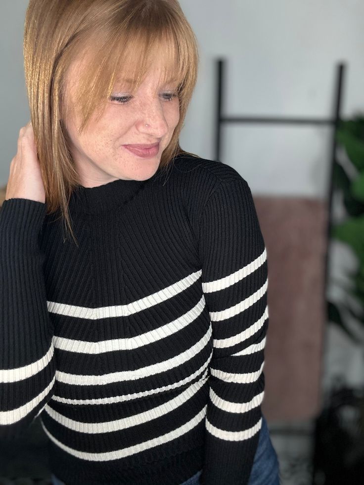 Stay warm in style with our Black And White Stripe Ribbed Sweater. This playful sweater features a trendy green and white stripe design, perfect for any occasion. Made from cozy ribbed material, you'll love the comfort and style this sweater brings to your wardrobe. What more could you ask for?! Material: 50% VISCOSE, 28% POLYESTER, 22% NYLON Sizing: Small: Sizes 4-6 Medium: Sizes 8-10 Large: 12-14 Model Info: Opal: Size 8, 36DD, 5’7 (true to size M wearing a M) Chic Sweater With Contrast Stripes For Winter, Trendy Striped Sweater With Ribbed Cuffs, Trendy Striped Cropped Sweater, Striped Long Sleeve Ribbed Sweater, Chic Striped Sweater With Ribbed Collar, Trendy White Ribbed Sweater, White Knit Sweater With Contrast Stripes, Trendy Long Sleeve Sweater With Contrast Stripes, Striped Long Sleeve Sweater With Ribbed Collar