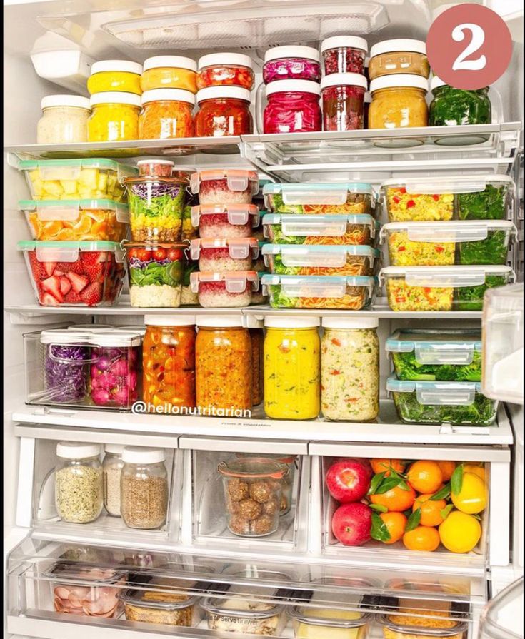 an open refrigerator filled with lots of food and condiments in it's doors