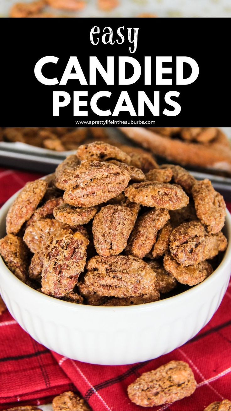 a white bowl filled with candied pecans on top of a red and black checkered table cloth