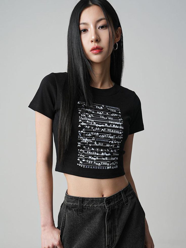 This product integrates text-based design into a crop t-shirt, offering a modern graphic twist on a classic casual piece. Its cropped length pairs seamlessly with high-waisted pants for a look that's both on-trend and comfortable. The bold lettering creates a dynamic visual interest that makes this top an instant conversation starter. - This tee is characterized by its engaging letter print, ensuring a striking visual statement.- Tailored for a snug fit, the shirt hugs the body comfortably, making it ideal for a variety of casual outings.- It's designed to maintain its shape and graphic integrity, even after multiple washes.- The crop style allows for versatile styling, suitable for layering or wearing on its own for a statement look. Trendy Cropped T-shirt With Letter Print For Streetwear, Cotton Cropped T-shirt With Graphic Design For Streetwear, Y2k Cropped T-shirt With Letter Print For Spring, Trendy Boxy Cropped T-shirt For Streetwear, Edgy Cotton Cropped T-shirt, Black Slogan Cropped T-shirt For Streetwear, Cotton Cropped T-shirt With Logo Print, Cropped Cotton T-shirt With Logo Print, Edgy Cropped T-shirt For Streetwear