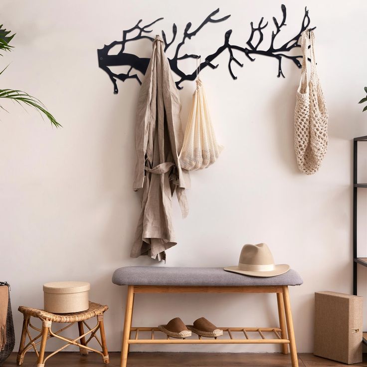 a bench and coat rack in a room