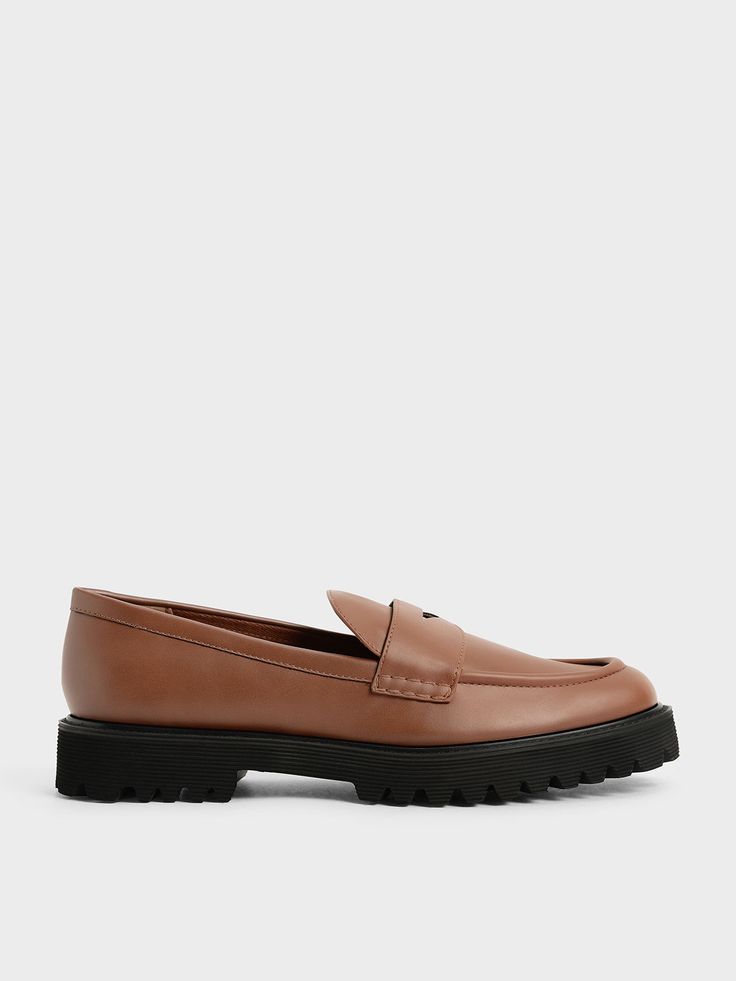 Sophisticated and versatile, these chunky penny loafers will soon become your go-to shoe in no time. You can always rely on the cognac colour to complement your outfits, whilst the covered almond toe gives them a classic vibe. Bonus points for the cleated block heel and raised sole which will give all your outfits an elevated look. Try them on with a light cardigan tucked in a pleated skirt and semi-precious stone jewellery for an edgy and feminine workplace ensemble. Chunky Penny Loafers, Kids Belt, Light Cardigan, Classic Vibe, Semiprecious Stone Jewelry, Stone Jewellery, Faux Leather Heels, Charles Keith, Brown Shoe