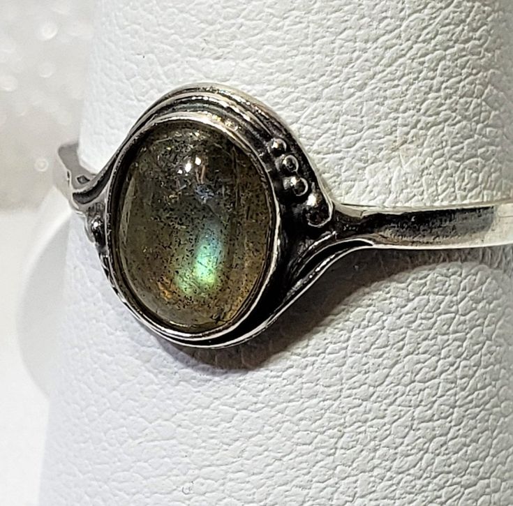 Magical Natural labradorite silver 925 mark ring szs 4-12 cabochon stone size 6 x 8 mm gift box included A semi-precious stone is also known as a gem or gemstone (also a jewel, a gem, a precious stone), which is a portion of mineral, which, in refined and cut form, is used to create jewelry or other embellishments. There are also organic resources or precise rocks that are not minerals (for example jet or amber) that are also used for jewelry and would also be considered to be gemstones, as well Collectible Oval Cabochon Moonstone Ring, Moonstone Stackable Rings For Gift, May Birthstone Jewelry With Stone Setting, Oval Moonstone Stackable Rings As Gift, Unique Oval Moonstone Ring With Bezel Setting, Adjustable Moonstone Jewelry With Round Stone, Oval Cabochon Moonstone Jewelry, Fine Jewelry Adjustable Nickel-free Rings, Adjustable Nickel-free Fine Jewelry Rings