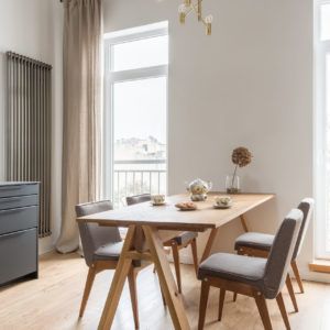 a dining room table with four chairs around it