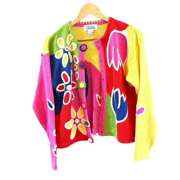 Vintage Nicole Summers Floral Patchwork Cardigan Bright Colorful Bloomcore Large Eye-catching floral patchwork cardigan that adds a splash of color to any wardrobe. Made from a durable ramie-cotton blend for comfort and longevity.  Buttons are covered with crocheted flowers. * Vibrant floral patchwork design * Button-down front * Durable ramie-cotton blend * Long sleeves * Nicole Summers brand Style: Bloomcore, 1980s, Patchwork Content: Ramie, Cotton Washing Instructions: Handwash Measurements: Armpit to armpit: 24" Back of Collar to Bottom Hem: 2" We ship most items out the next business day. Please contact us with any additional questions. We are happy to combine shipping when possible. Thank you! 2535 Features: * Bloomcore, 1980s, Patchwork Size: Womens Large Condition: Pre-Owned Good Spring Cotton Cardigan With Floral Print, Spring Floral Print Cotton Cardigan, Casual Multicolor Floral Print Cardigan, Spring Patchwork Long Sleeve Cardigan, Multicolor Long Sleeve Cardigan For Spring, Multicolor Color Block Sweater For Spring, Colorful Color Block Sweater For Spring, Spring Vintage Patchwork Sweater, Spring Cotton Color Block Cardigan