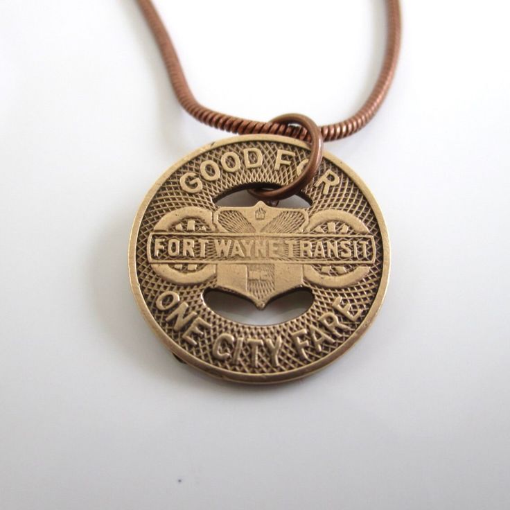 "A unique necklace that I made with an original Fort Wayne Transit token.  You can choose form the solid bronze version (this token was first used in 1950) or the silver tone (first used in the 1940's).  The silver tone doesn't read Fort Wayne; only Indiana on it.  I lightly polished the token to bring out the writing and color.  The first two photos show both types.  5/8\" in diameter.  The chain is an antiqued bronze tone or silver tone with nice lobster claw clasp (you can choose 18\" or 20\" length).  It will come in a new gift box and the one in the photos will be the exact token you receive.  If you need more than one, please let me know.  I also have other Fort Wayne token jewelry in my shop: www.etsy.com/shop/lucra?ref=shop_sugg&search_query=fort+wayne I can usually fill larger ord Repurposed Vintage, Fort Wayne, Coin Jewelry, Unique Necklace, Bronze Color, Unique Necklaces, Lobster Claw, Antique Bronze, Indiana