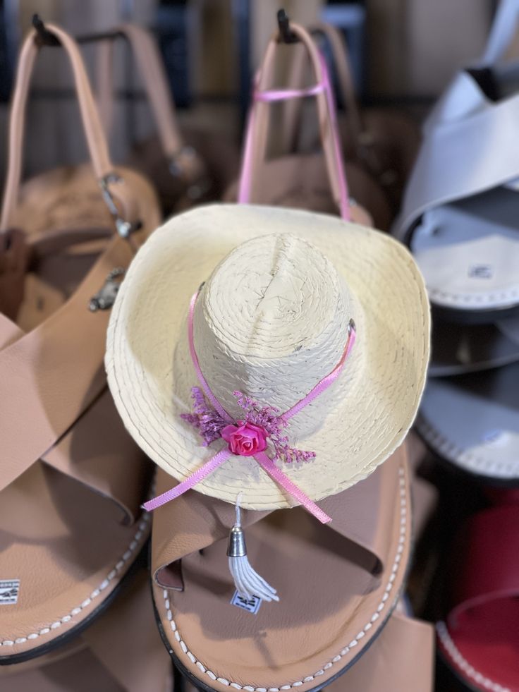 Sombrero con listón y arreglo Rosa. Adorno de sombrero para carro oh donde guste. Mide 7 pulgadas artesanal de sombrero calentano hecho en Tlapehuala. Un adormito muy bonito para cargarlo siempre contigo recordando Tierra Caliente. Mide mas oh menos 7 pulgadas. Mexican Sombrero hat handmade. This sombrero is very popular in Tierra Caliente. Measures about 7 inches. Adjustable Mini Hats For Rodeo And Kentucky Derby, Adjustable Mini Hats For Kentucky Derby And Country Events, Adjustable Cap For Kentucky Derby Costume, Adjustable Cap For Kentucky Derby, Adjustable Wide Brim Sun Hat As Gift, Country Style Adjustable Top Hat For Summer, Adjustable Brimmed Vacation Hat, Adjustable Brimmed Costume Hat For Vacation, Adjustable Brimmed Straw Hat As Gift