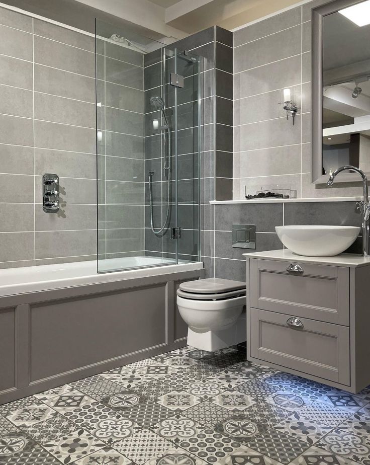 a bathroom that has a toilet, sink and bathtub in the middle of it