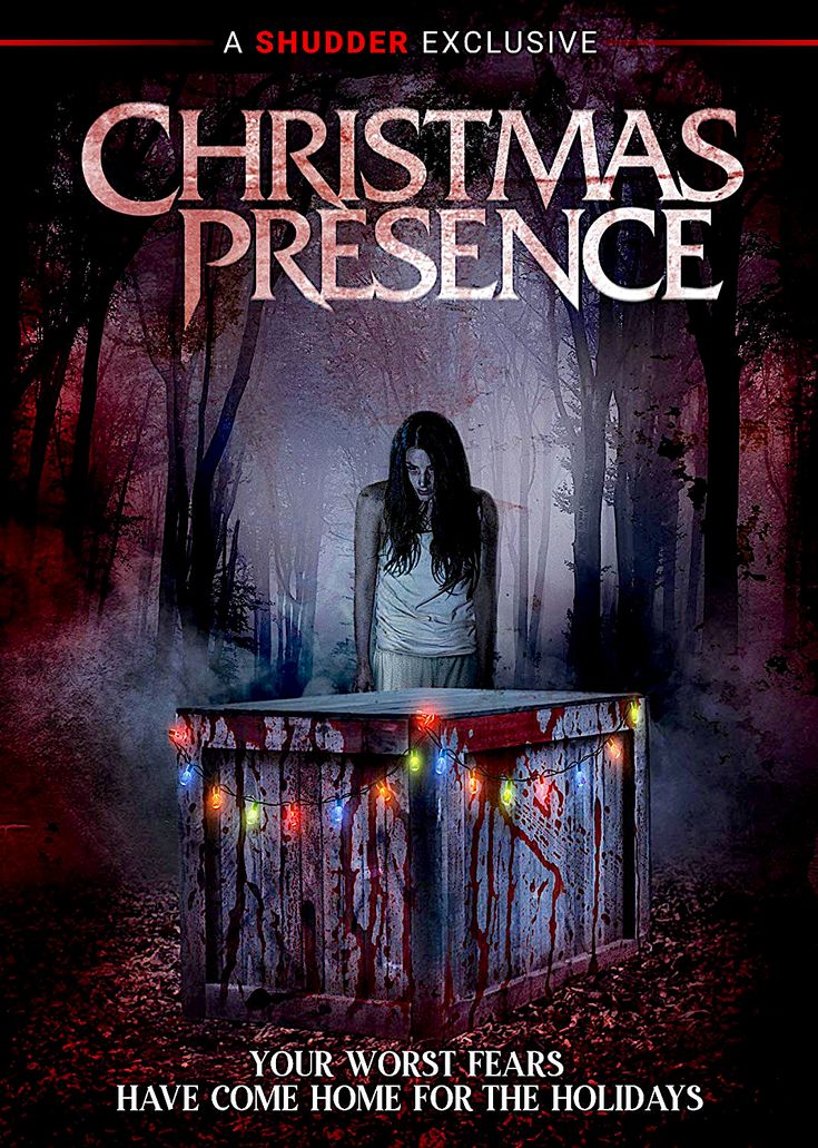 a movie poster for christmas presence with a creepy woman sitting at a table in the woods