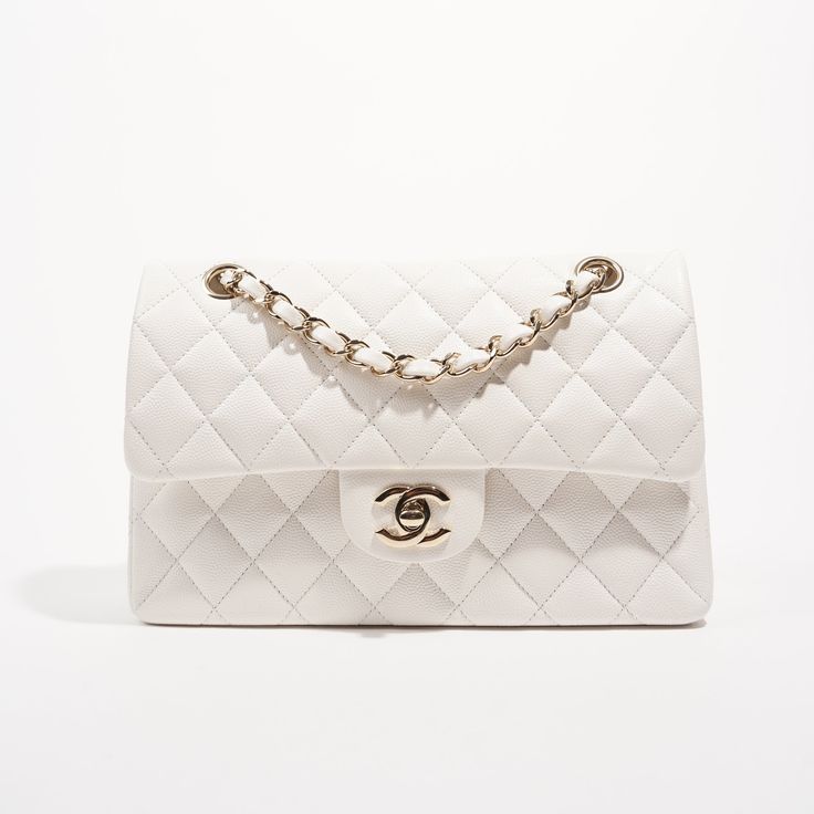 Brand: Chanel Style: Classic Flap Size: Small Width: 23.5 cm Height: 15 cm Depth: 7 cm Handle Drop: 24 - 44 cm Condition: As New Exterior Colour: White Interior Colour: White Hardware Colour: Gold﻿Leather Type: Caviar (Grained Calfskin) Serial Code: 30****** Manufactured In: France | 2020 Comes With:﻿ , Dustbag and Luxe Collective DustbagDelivery 5-8 or 10-15 working days Please note that during high season and Sale period, delivery times may be affected We accept payment with a Credit card, Deb Chanel Classic Flap Bag Small, Vintage Chanel Bag, White Hardware, Dream Bag, Chanel Style, Future Wardrobe, Interior Colour, Bag Collection, Chanel Jewelry