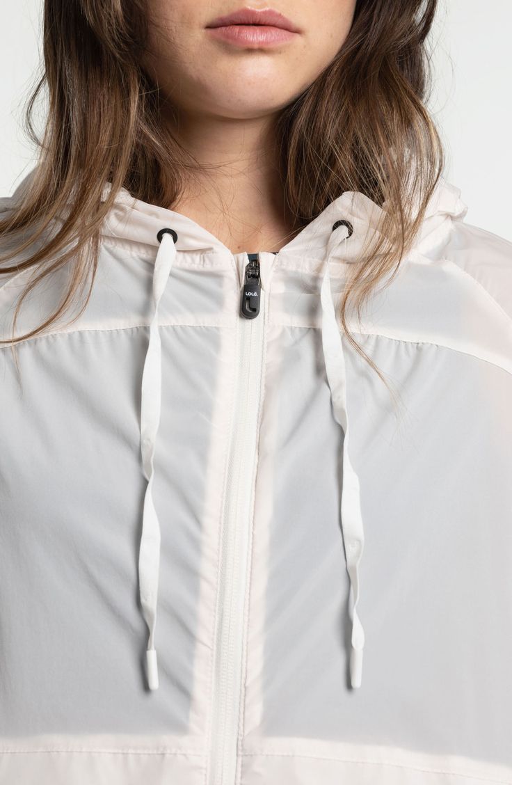 This ultralightweight, water-repellent jacket is ready for whatever the day holds and packs away into its front pocket when the weather changes. 24" front length; 28" back length (size Medium) Fixed hood Packs into pocket 88% nylon,12% elastane Machine wash, tumble dry Imported White Spring Travel Outerwear, Spring Functional Windbreaker With Drawstring Hood, Casual Nylon Raincoat With Drawstring Hood, Spring Windbreaker With Functional Drawstring For Outdoor Activities, Spring Nylon Outerwear For Outdoor Activities, Spring Functional Windbreaker With Adjustable Hood, Casual Lightweight Waterproof Windbreaker, Athleisure Nylon Outerwear For Travel, Nylon Athleisure Windbreaker With Drawstring Hood