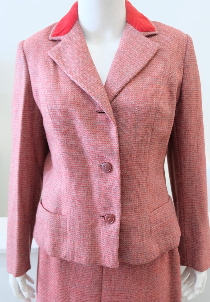 "1960's Vintage WOMENS' A David Crystal Fashion Red Grey Tweed Woolen Wool Suit with Fitted Jacket and Pencil Skirt Velvet Collar Colors : Grey Red Jacket: Semi Fitted Hip Length with 2 shallow flap hip pockets notched lapel collar with red velvet at neckline back has low cross over belt crepe rayon lining tag reads: A David Crystal Fashion 3/4 sleeve 15.5\" across shoulders 19\" across chest 16\" across bottom 23\" from shoulder seam to end of sleeve 21\" from front length from shoulder seam to Formal Red Tweed Jacket, Red Fitted Tweed Blazer, Fitted Red Tweed Blazer, Classic Red Tweed Jacket For Work, Red Fitted Tweed Jacket For Formal Occasions, Fitted Red Wool Tweed Jacket, Red Fitted Wool Tweed Jacket, Vintage Tweed Skirt Suit For Formal Occasions, Fitted Pink Tweed Jacket For Formal Occasions