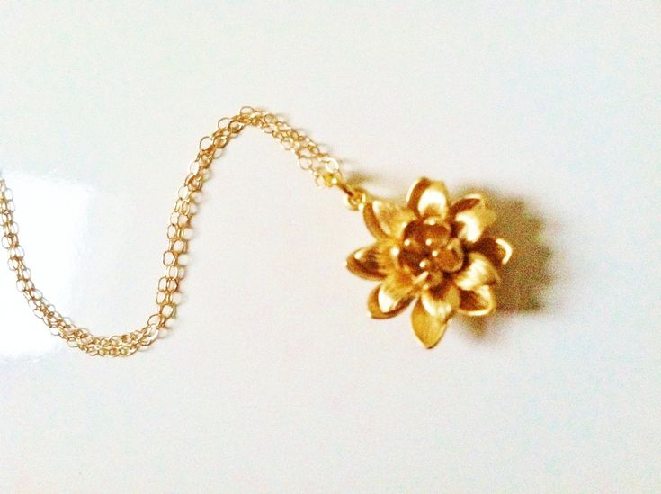 Gold lotus necklace, gold flower necklace,14k gold filled chain  A beautiful golden lotus flower strung onto fine 14k gold filled chain not gold  plated  . A lovely and elegant necklace mom, grandma,mother-in-low, sister,daughter or aany1 you can give as a beautiul gift  Comes in a  gift box nicely wrapped with theribbon  18mm * 18mm gold plated brass lotus. Gold filled chain total 16 inches long, you can choose the length upto 18 inches in no additional charge, just convo me during check out  A Delicate Handmade Gold Charm Necklaces, 14k Gold Filled Flower Necklace, 14k Gold-filled Flower Necklace, Gold Flower Pendant Necklace As Gift For Mom, Gold Necklace With Flower Charm In Brass, Delicate Gold Flower Necklace As Gift, Gold Brass Necklace With Flower Charm, Delicate Gold Flower Necklace For Gift, Gold Flower Jewelry For Meditation