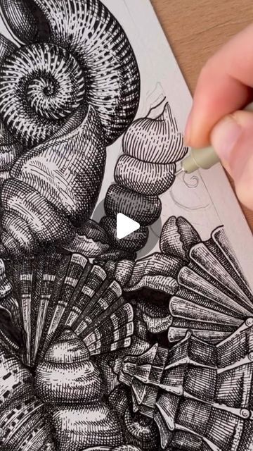 someone is drawing an image with pencils on paper