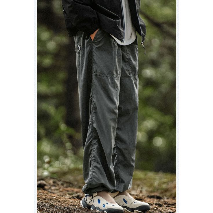 Seasonal Outdoor Functional Windproof Cargo Pants Fabric: 100% Nylon Size: S, M, L, XL, 2XL, Multiple Color Selections: Black, Gray  Season: Spring, Fall, Summer, Winter Utility Style Waterproof Bottoms For Streetwear, Utility Waterproof Bottoms For Streetwear, Waterproof Utility Bottoms For Streetwear, Baggy Cargo Pants For Winter Outdoor Use, Outdoor Techwear Long Pants, Gray Baggy Cargo Pants For Outdoor, Winter Outdoor Parachute Pants With Side Pockets, Gray Cotton Parachute Pants For Outdoor, Black Nylon Cargo Pants For Outdoor Activities