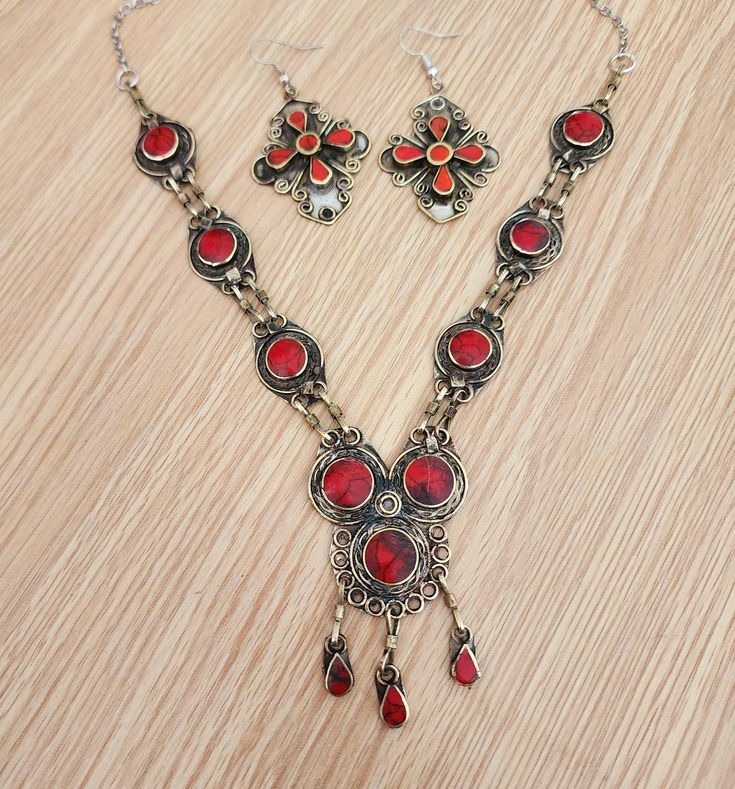 Boho Vintage necklace,afghan jewelry,bib necklace,statement,tribal red necklace,ethnic,gift for her,Kuchi jewelry,antique finish, size:20" beautiful vintage Afghan red traditional necklace. This tribal necklace is inspired by vintage kuchi jewelry. sets very well around the neck and looks amazing with any outfit. Bohemian Metal Necklace With Jewels, Bohemian Oxidized Jewelry As Gift, Bohemian Oxidized Jewelry For Gift, Bohemian Jewelry With Oxidized Finish For Gift, Bohemian Jewelry With Oxidized Finish As Gift, Red Bohemian Bib Necklace For Festivals, Red Metal Dangle Necklace, Red Metal Jewelry With Oxidized Finish, Red Oxidized Metal Jewelry