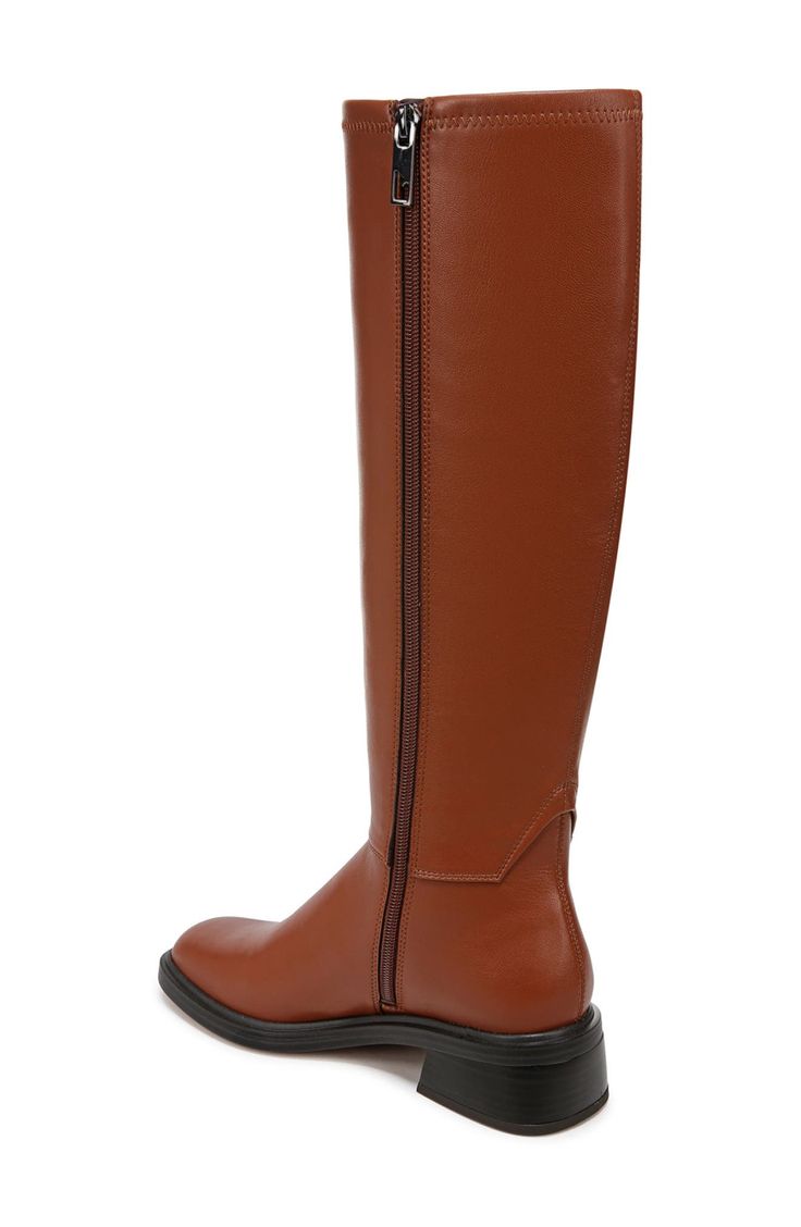 Classic details lend a refined appearance to this tall boot that's the perfect go-to for elevating in-office or off-duty looks. 1 3/4" heel; 6" shaft; 9 3/4" calf circumference Synthetic upper, lining and sole Imported Knee-high Boots For Workwear, Classic Tall Heeled Boots For Fall, Wide Calf High Shaft Heeled Boots For Work, Classic Knee-high Boots With High Shaft For Work, Classic High Shaft Knee-high Boots For Work, Classic High Shaft Boots For Office, Classic Almond Toe Knee-high Boots For Fall, Classic Knee-high Boots With Medium Width, Brown Knee-high Boots With Medium Width