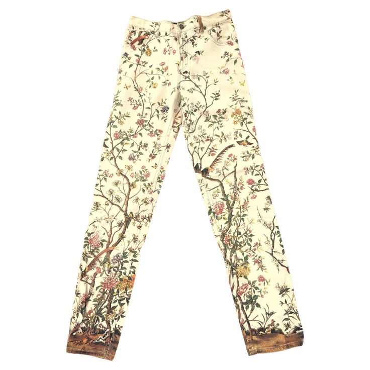 This exceptional (and hard to find a similar) vintage Roberto Cavalli’s floral pants from the 1990s is considered an iconic piece that captured the flamboyant and eclectic spirit of the decade. It reflects his signature style of blending nature-inspired motifs with luxurious materials and intricate detailing. These pants were not just fashion items but statements of boldness and individuality, appealing to those who wanted to make a striking impression. Roberto Cavalli, the renowned Italian fashion designer, is celebrated for his exuberant, bold, and vibrant designs. In the 1990s, Cavalli's creations embodied the opulent and extravagant spirit of the decade, characterized by unique prints, luxurious fabrics, and intricate details. Among his most iconic pieces from this era were pants featu Roberto Cavalli Vintage, Vintage Roberto Cavalli, Jeans Trousers Women, Leopard Ankle Boots, Roberto Cavalli Dress, 90s Runway, Vintage Flare, The 1990s, Unique Prints