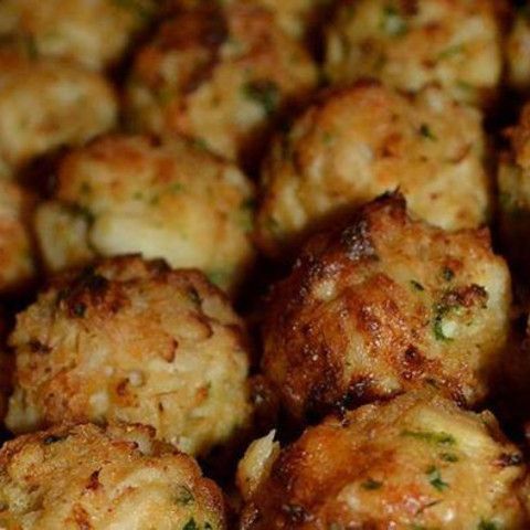 close up view of cooked meatballs with parsley