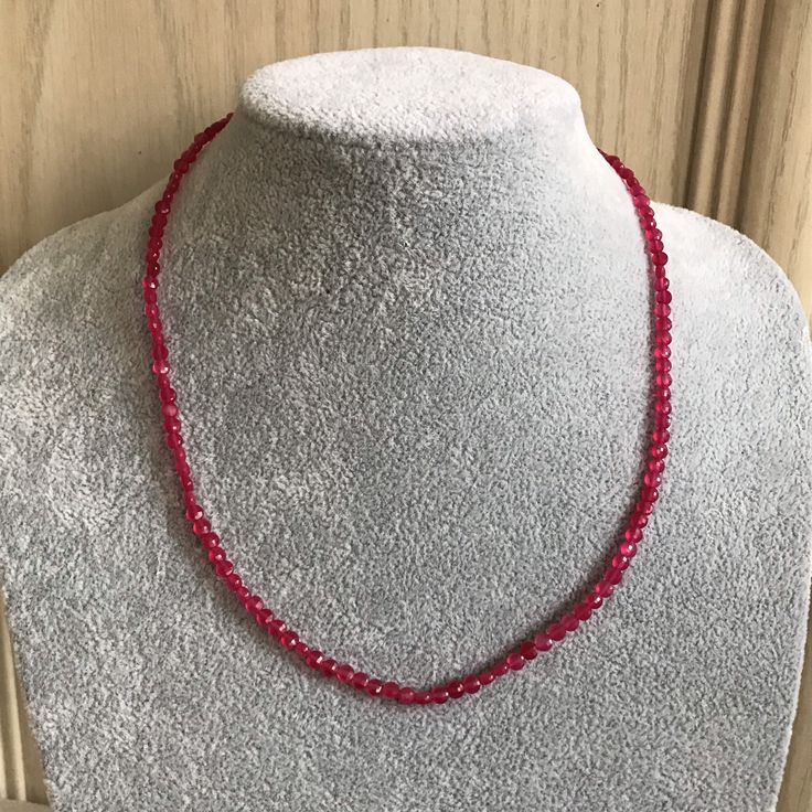 Ruby necklace. This is a faceted round shape beaded Ruby necklace. The Ruby necklace has a Silver lobster claw fastening . I can send this Ruby necklace to you or to someone else anywhere in the world with your message. Dimensions  Necklace length 18 inches  Necklace width 4mm An ideal gift for Birthday, Weddings jewellery Bridesmaids gift, Anniversary gift, Graduation gift,Holiday jewellery and Everyday . Contact  You can contact me anytime on my shop email with any questions, order and request, Pink Pearl Necklace With Faceted Beads As Gift, Party Necklaces With Lobster Clasp And Round Beads, Wedding Briolette Faceted Necklaces, Handmade Red Round Bridal Necklace, Adjustable Faceted Beads Necklace For Wedding, Red Rondelle Jewelry For Gifts, Adjustable Rondelle Necklaces Perfect For Gifts, Handmade Briolette Crystal Necklace Gift, Adjustable Rondelle Beaded Necklaces As Gifts