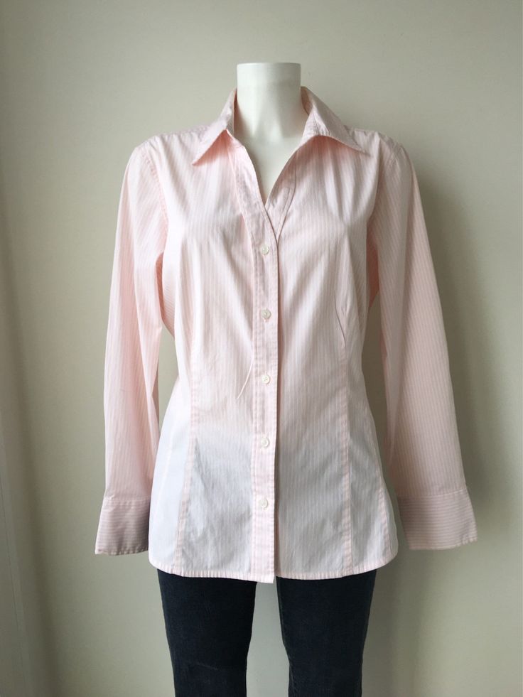 "Sweet vintage 90s Plus size XL shirt in a very light Pink with white stripes. So comfortable, moves with you , made from cotton and spandex Features a button up style, an Open collar , darts and Long cuffed sleeves In a Plus size and Tailored for a Completly figure flattering fit! Preppy shirt, womans blouse, pair with jeans or a pleated skirt Very good condition! XL size chest 45\" legnth 27.5\" waist 39\" sleeves 24\" Label Gap" Striped Shirt For Office In Spring, Pink Cotton Shirt With Striped Collar, Office Cotton Shirt With Vertical Stripes, Vertical Striped Shirt For Office In Spring, Vertical Stripes Shirt For Office In Spring, Spring Office Shirt With Vertical Stripes, Pinstripe Cotton Button-up Blouse, Cotton Pinstripe Blouse With Striped Collar, Pinstripe Cotton Blouse With Striped Collar